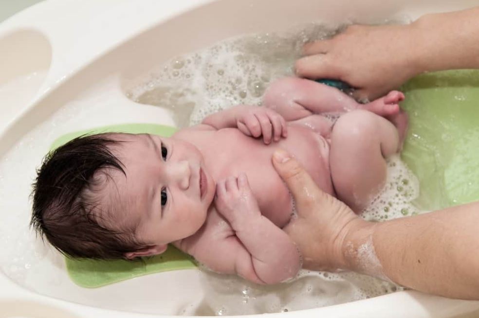 baby being washed